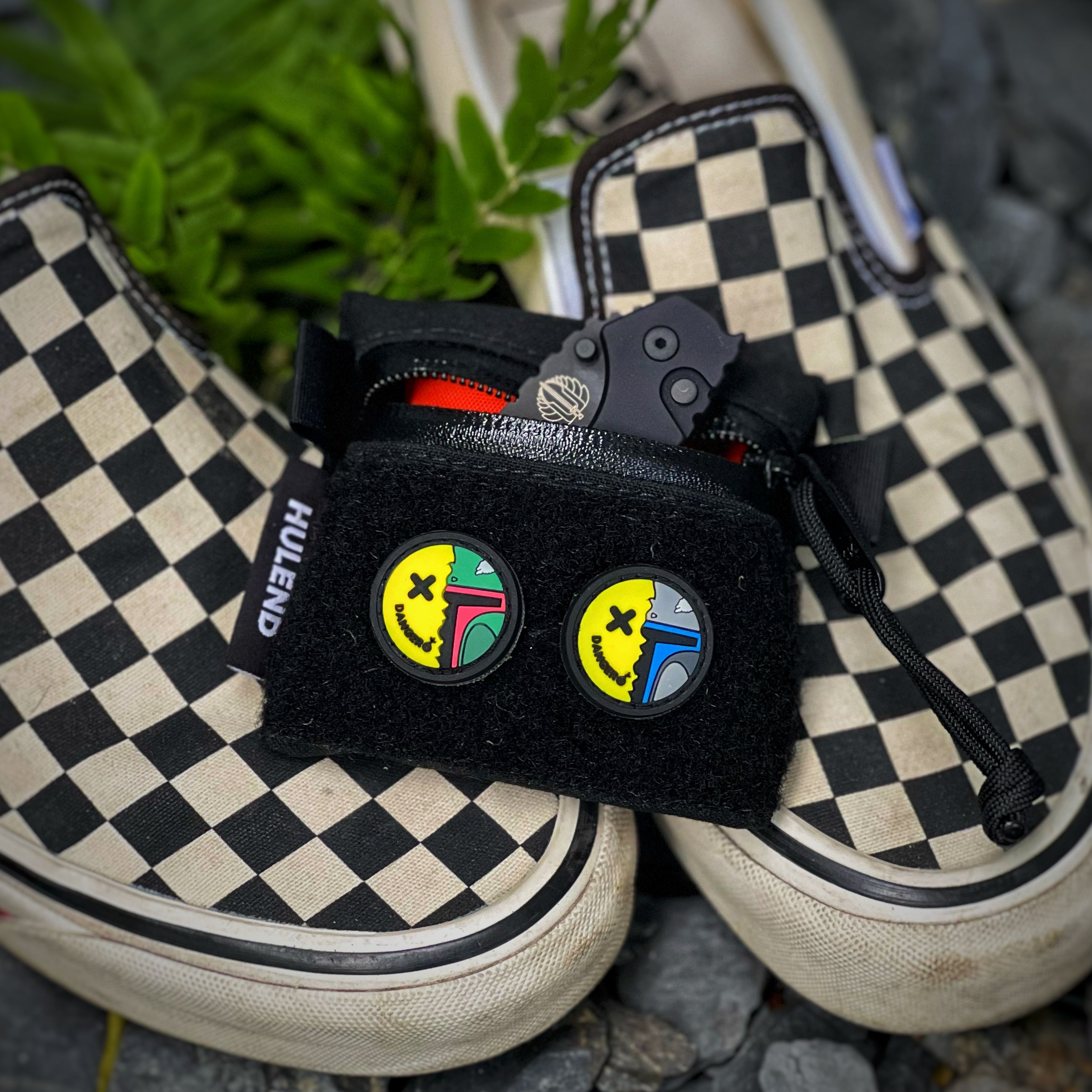 Two Pvc rubber Yellow smile face patches with half of face covered by green black mask and other smiled face covered by grey blue mask