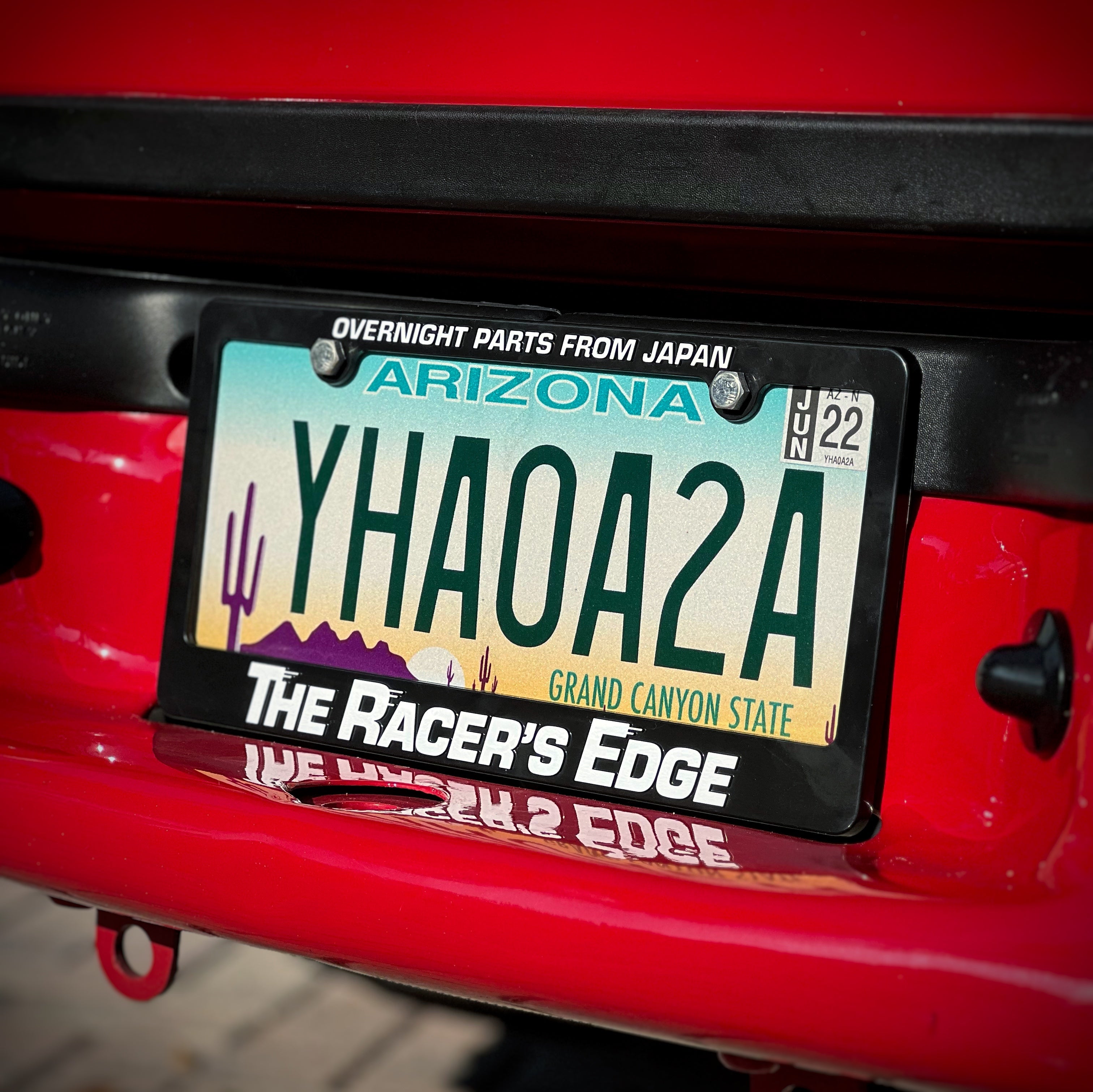 Racers Edge “ Overnight Parts from Japan ” License Plate Frame