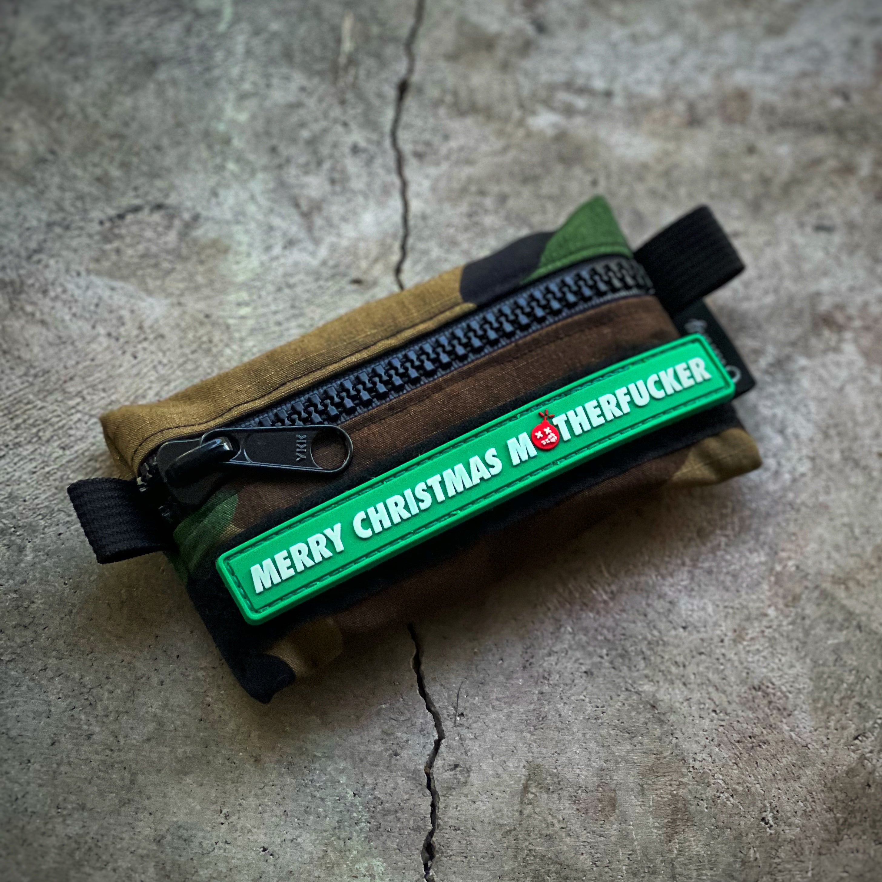 Green Rubber Patch with white text that reads merry christmas motherfucker in white font color