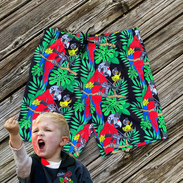 Red and Green Hawaiian print swim shorts for Toddlers depicting a Yellow Duck and red macaw Parrot