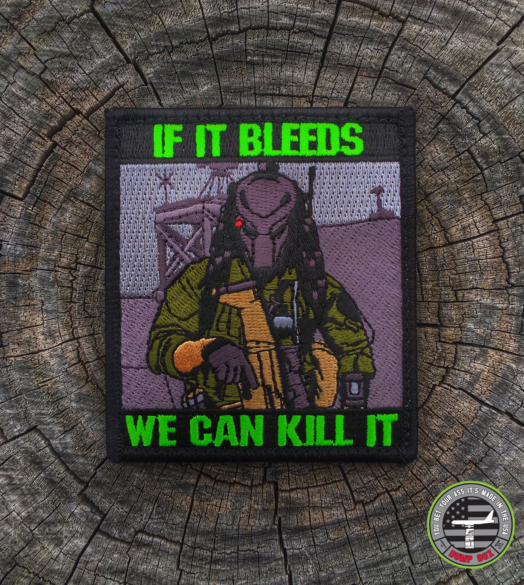 Embroidered patch depicting A man wearing a mask while holding a gun with text that reads If it bleeds we can kill it