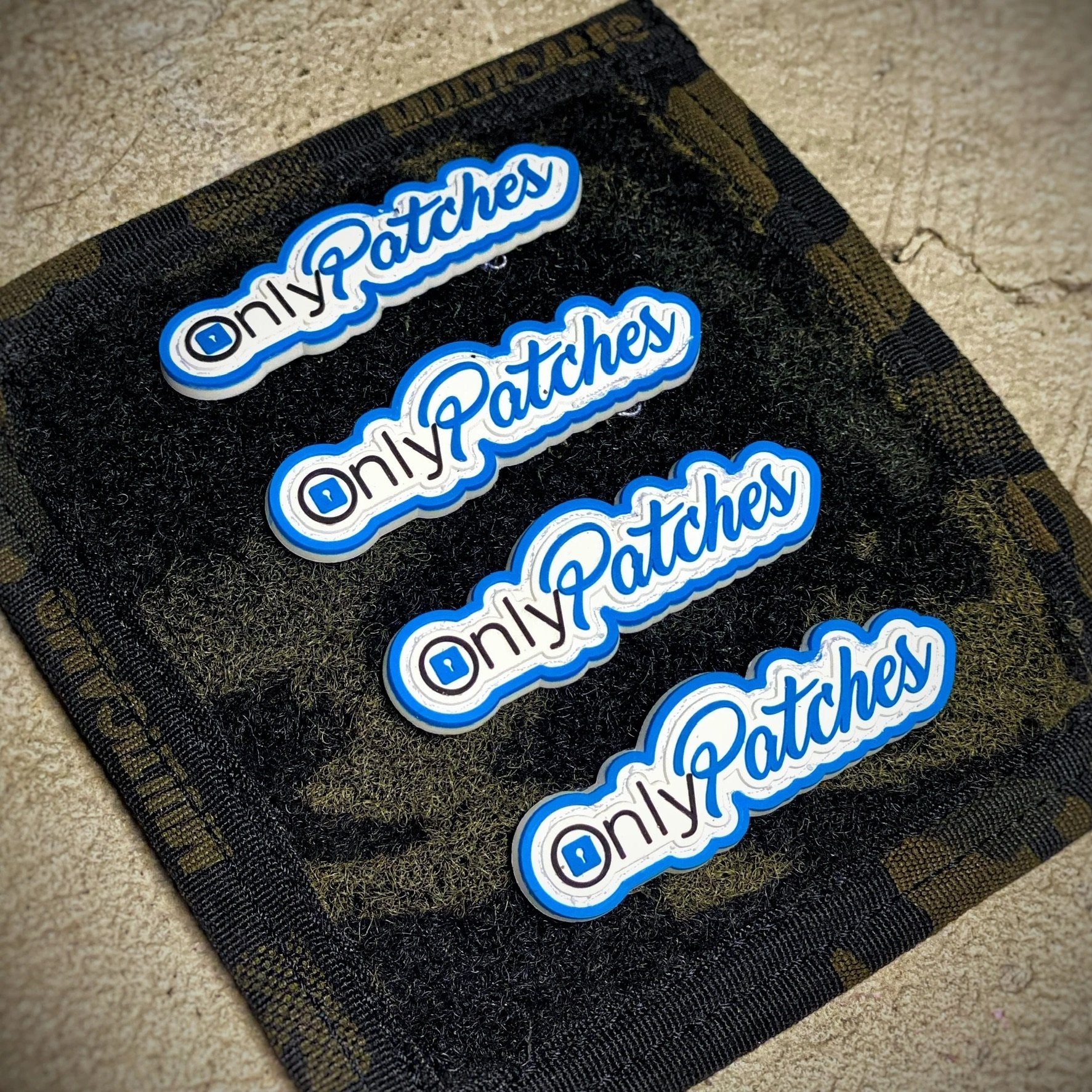 White and blue PVC patch that reads Only Patches